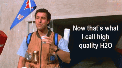 A Man Holding A Cup With The Words Now That 'S What I Call High Quality H20 GIF