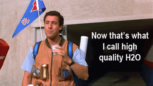 A Man Holding A Cup With The Words " Now That 'S What I Call High Quality H20 " On The Bottom GIF