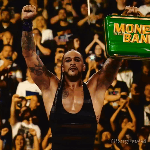 A Man Holding A Green Money In The Bank GIF