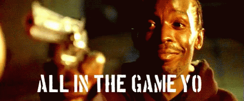A Man Holding A Gun With The Words " All In The Game Yo " Written Below Him GIF