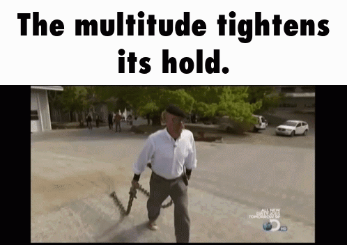 A Man Holding A Gun With The Words The Multitude Tightens Its Hold Above Him GIF