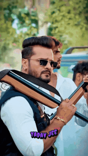 A Man Holding A Gun With Yaday Jee Written In The Corner GIF