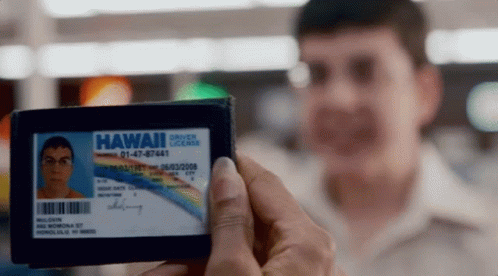 A Man Holding A Hawaii Driver License In His Hand GIF