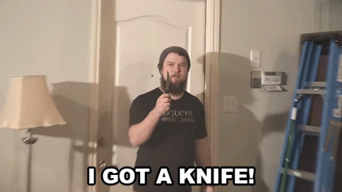 a man holding a knife with the words i got a knife behind him