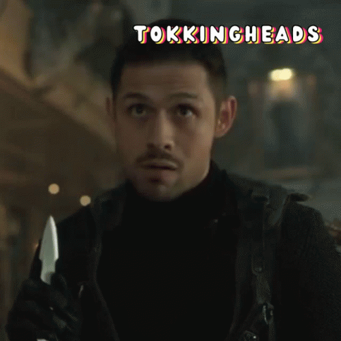 A Man Holding A Knife With The Words Tokingheads Written Above Him GIF