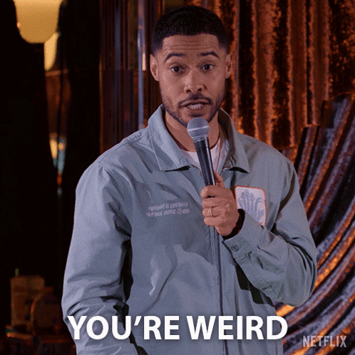 A Man Holding A Microphone And Saying You 'Re Weird On Netflix GIF