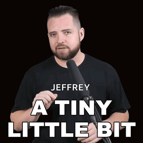 A Man Holding A Microphone With The Words Jeffrey A Tiny Little Bit Written Above Him GIF