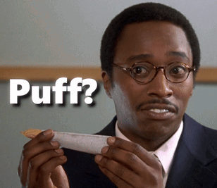 A Man Holding A Piece Of Paper With The Word Puff Written On It GIF