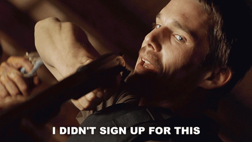 A Man Holding A Piece Of Wood With The Words " I Did N't Sign Up For This " Above Him GIF