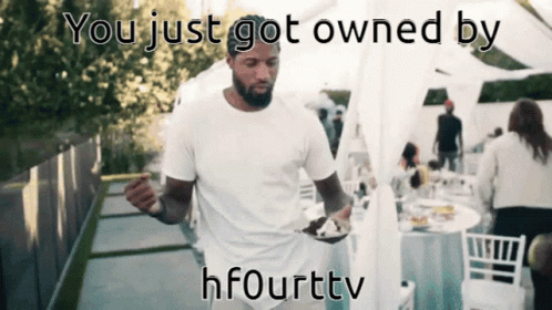 a man holding a plate of food with the words you just got owned by hfourttv on the bottom