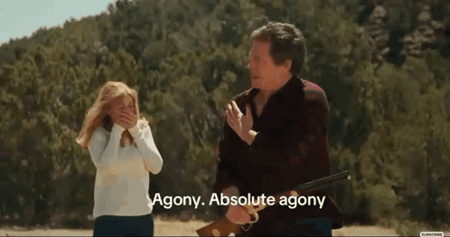 A Man Holding A Rifle With Agony Absolute Agony Written Below Him GIF