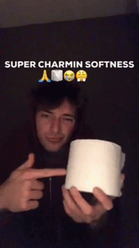 A Man Holding A Roll Of Toilet Paper With The Caption Super Charmin Softness Above Him GIF