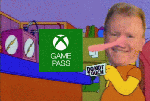 A Man Holding A Sign That Says Do Not Touch In Front Of An Xbox Logo GIF