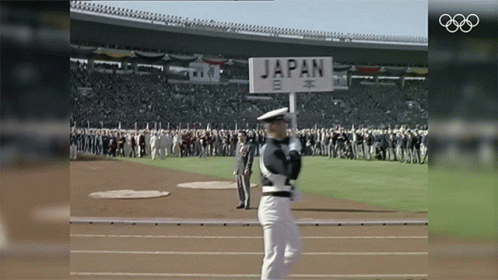 a man holding a sign that says japan