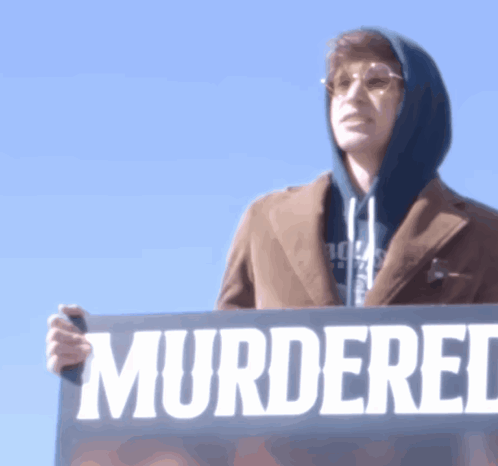 Man Holding Sign Murdered GIF