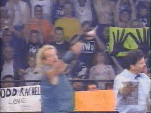 A Man Holding A Sign That Says Odd Rachel Love GIF