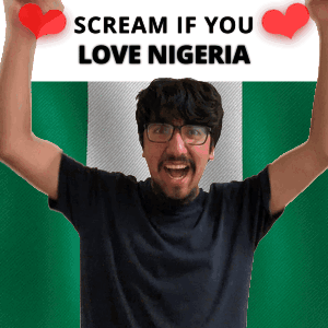A Man Holding A Sign That Says Scream If You Love Nigeria GIF