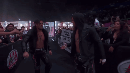 A Man Holding A Sign That Says United Has Stood Together For A Long Time GIF