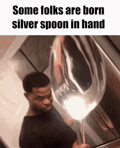 A Man Holding A Silver Spoon In His Hand With The Caption Some Folks Are Born Silver Spoon In Hand GIF