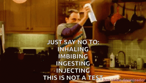 A Man Holding A Spray Bottle In A Kitchen Says Just Say No To Inhaling Imbibing Ingesting Injecting GIF