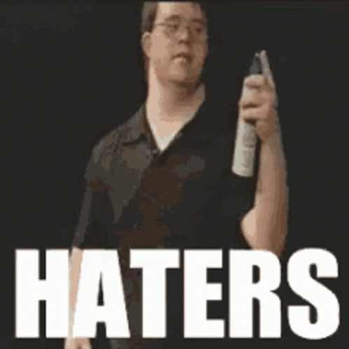 A Man Holding A Spray Can With The Word Haters In White GIF