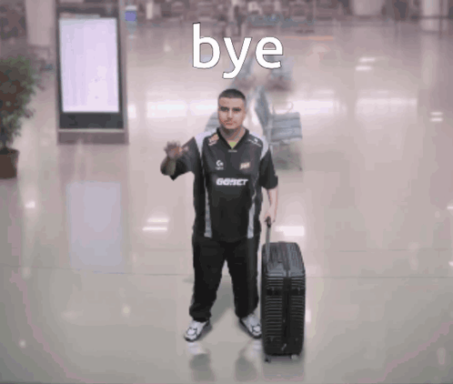 A Man Holding A Suitcase With The Word Bye Written On It GIF
