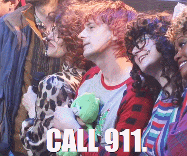 A Man Holding A Teddy Bear With The Words Call 911 On The Bottom GIF