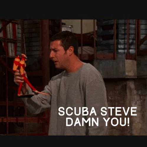 A Man Holding A Toy With The Words Scuba Steve Damn You Below Him GIF