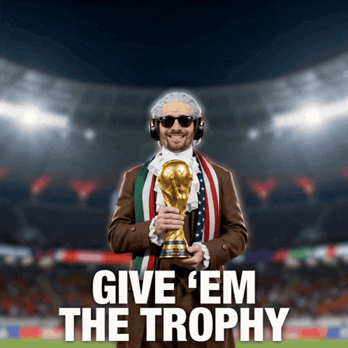 A Man Holding A Trophy With The Words Give ' Em The Trophy Below Him GIF