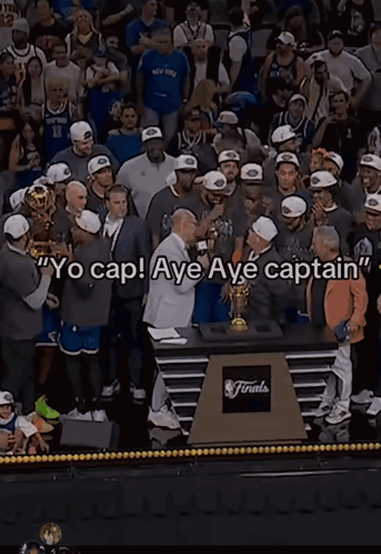 A Man Holding A Trophy With The Words Yo Cap Aye Aye Captain Written On It GIF