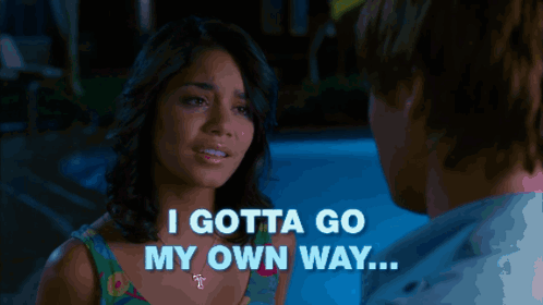 A Man Holding A Woman 'S Hand With The Words " I Gotta Go My Own Way " Behind Him GIF