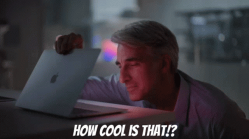 A Man Holding An Apple Laptop With The Words How Cool Is That Below Him GIF