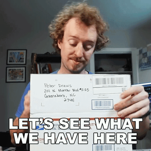A Man Holding An Envelope Addressed To Peter Draws In Greensboro Nc GIF