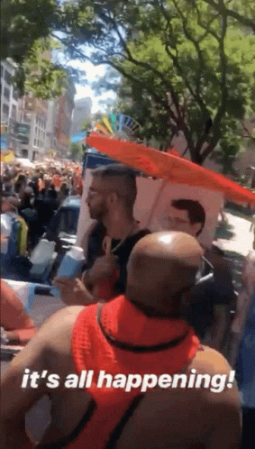 A Man Holding An Umbrella Says It 'S All Happening ! GIF