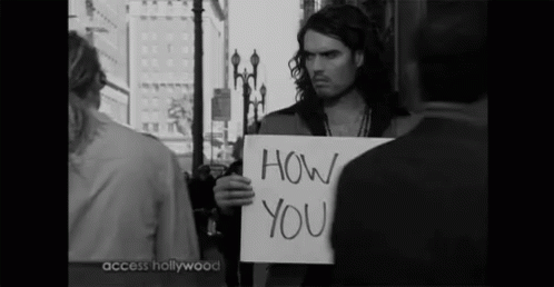 A Man Holds A Sign That Says How You GIF