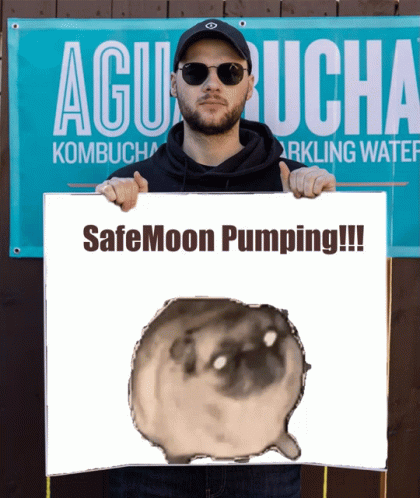 A Man Holds A Sign That Says Safemoon Pumping GIF