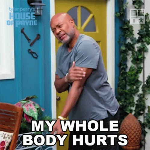A Man Holds His Arm In Pain And Says My Whole Body Hurts GIF
