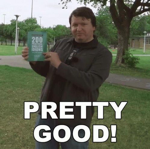 A Man Holds Up A Book Titled 200 Practical French Idioms GIF