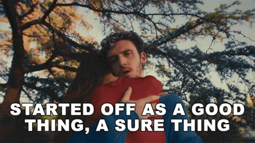 A Man Hugging A Woman With The Words Started Off As A Good Thing A Sure Thing Below Him GIF