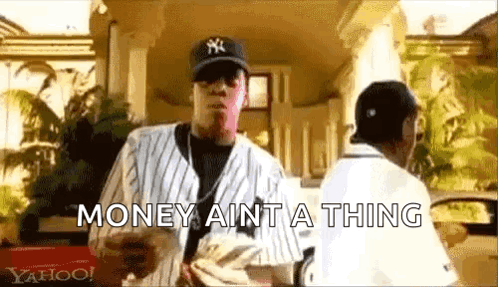 A Man In A Baseball Cap Is Holding A Bunch Of Money And Says `` Money Ain T A Thing '' . GIF