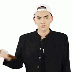 A Man In A Baseball Cap Is Holding A Hammer In His Hand And A Heart Is Behind Him . GIF