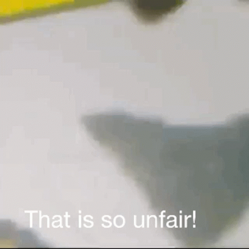 A Man In A Baseball Cap Is Standing In A Kitchen With The Words That Is So Unfair Written Below Him . GIF