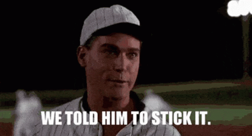 A Man In A Baseball Cap Is Standing On A Baseball Field And Says `` We Told Him To Stick It '' . GIF