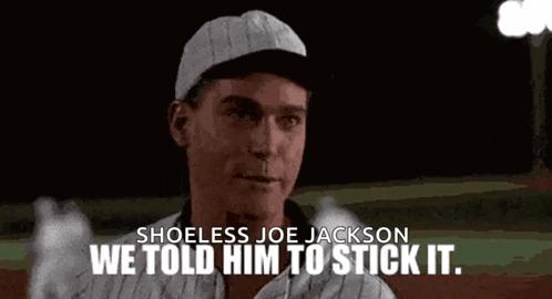 A Man In A Baseball Cap Is Standing On A Baseball Field . GIF