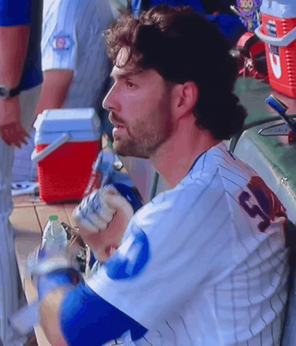 A Man In A Baseball Uniform With The Number 13 On The Back GIF