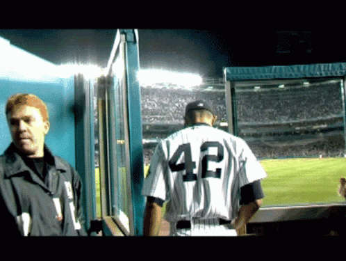 A Man In A Baseball Uniform With The Number 42 On It GIF