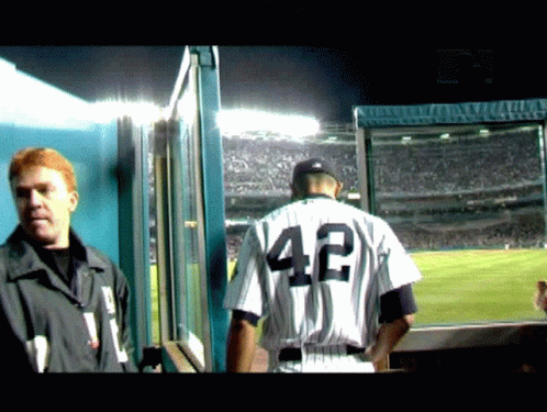 A Man In A Baseball Uniform With The Number 42 On The Back GIF