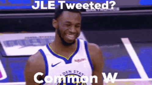 A Man In A Basketball Uniform Is Smiling On A Court . GIF