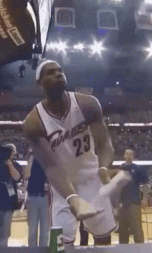 A Man In A Basketball Uniform With The Number 23 GIF