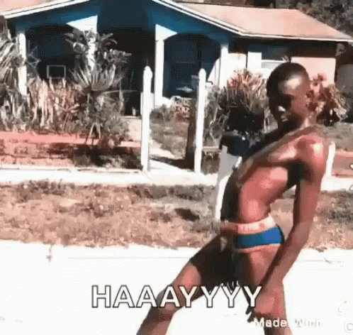 A Man In A Bathing Suit Is Dancing In Front Of A House And Says Haaayyy . GIF